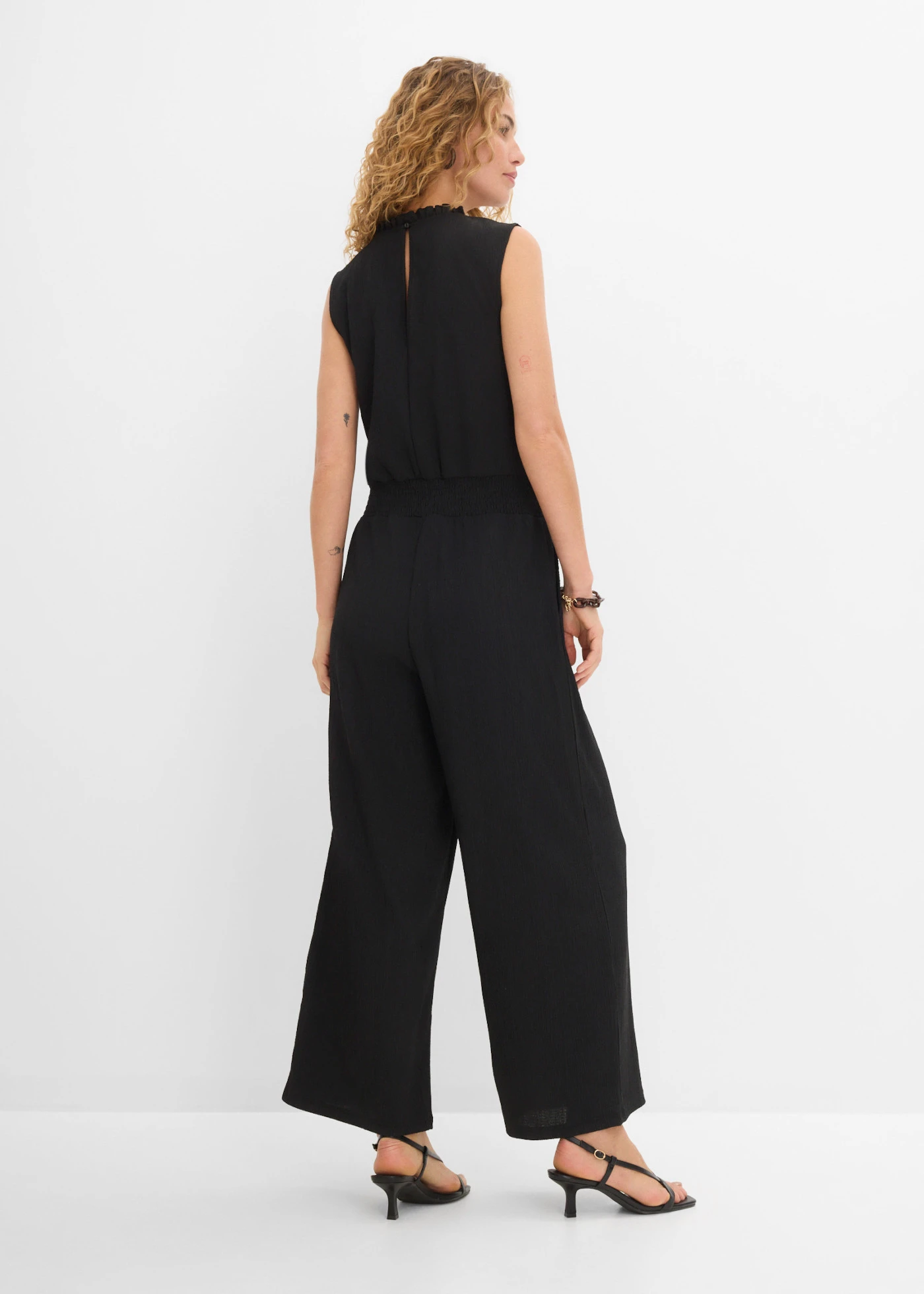 Jersey jumpsuit van gestructureerde crêpe • zwart • product-page.page-title-suffix