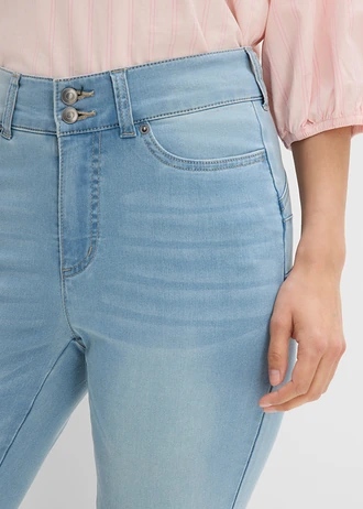 Modelujące dżinsy o kroju bootcut, mid waist • jasnoniebieski denim "used" • sklep bonprix