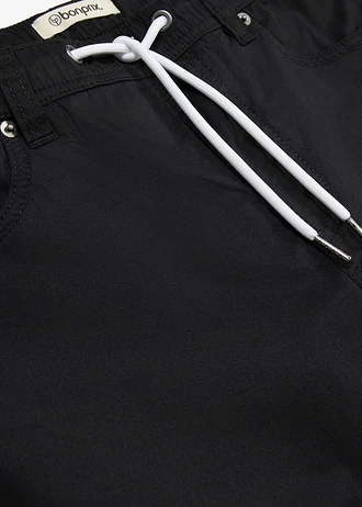 Spodnie z gumką w talii, ze stretchem i zwężanymi nogawkami, regular fit • czarno-biały • sklep bonprix