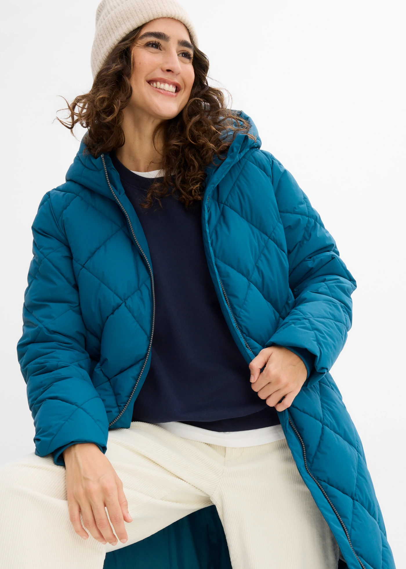 Lange gewatteerde jas met capuchon • blauwpetrol • bonprix online shop